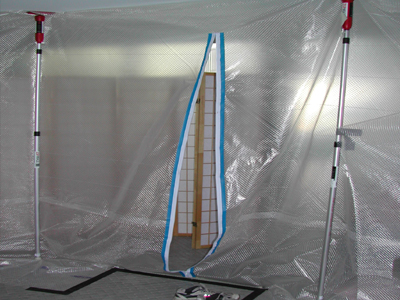 A containment barrier with a zippered entrance