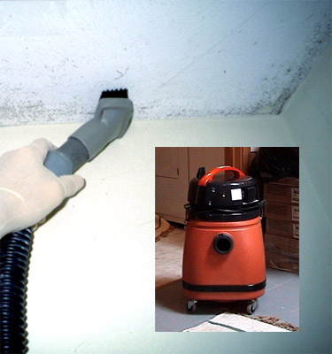 HEPA vacuuming equipment in use